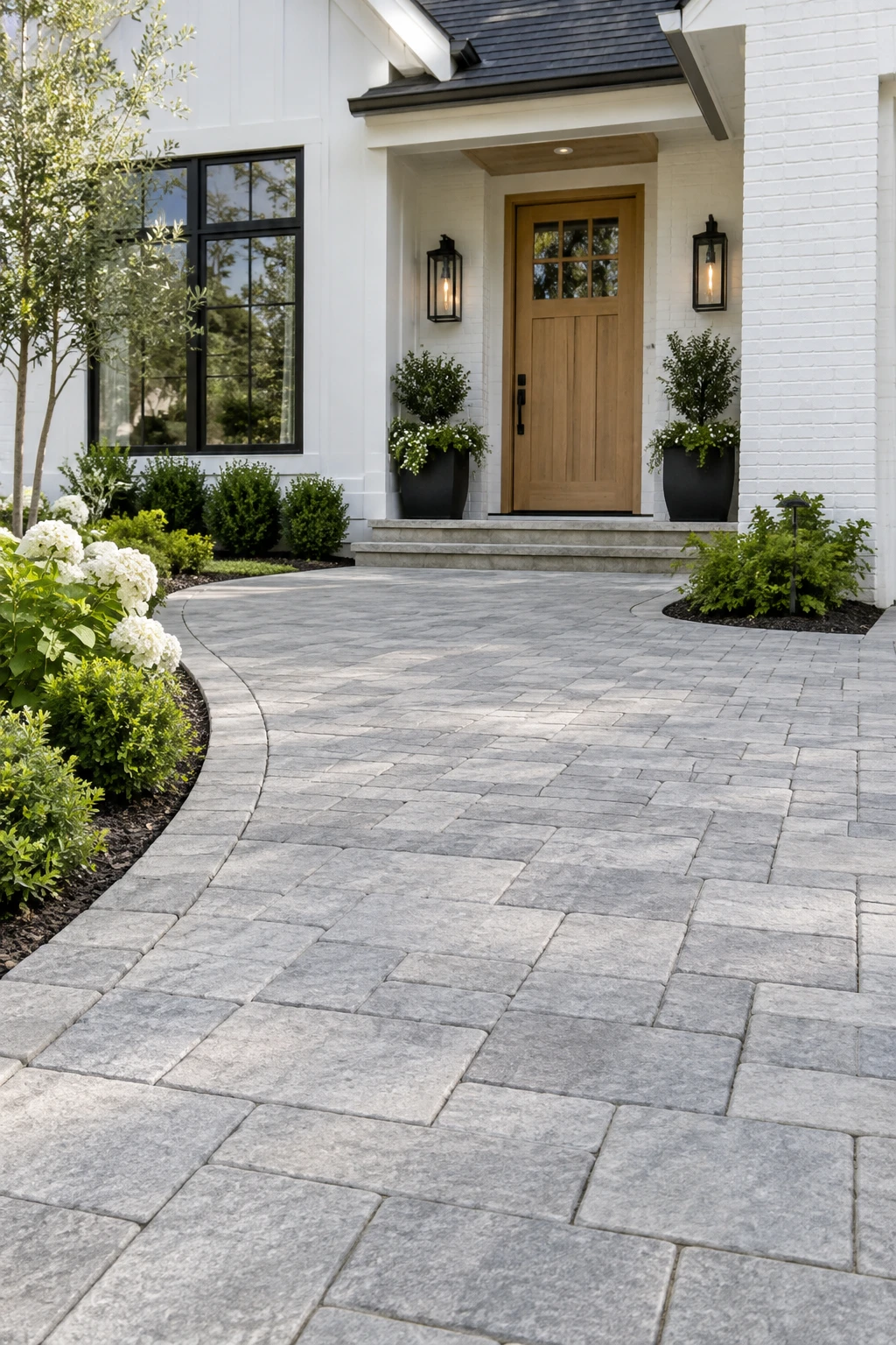Illustrative home entrance with precisely installed light stone pavers